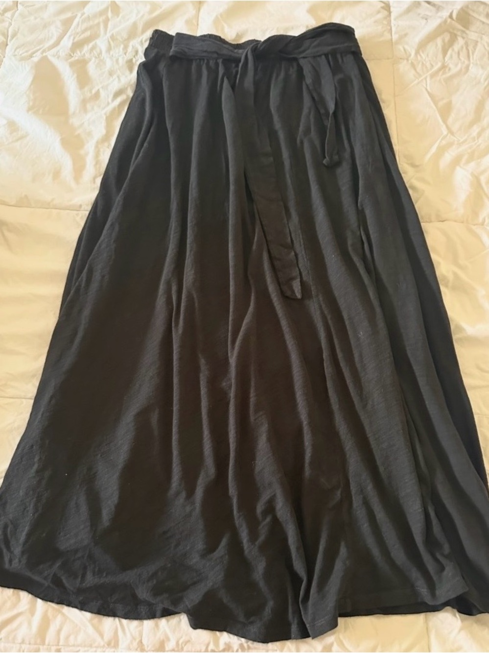 Torrid Black Flowing Swim Coverup Skirt with Tie Waist and slit all the way up.